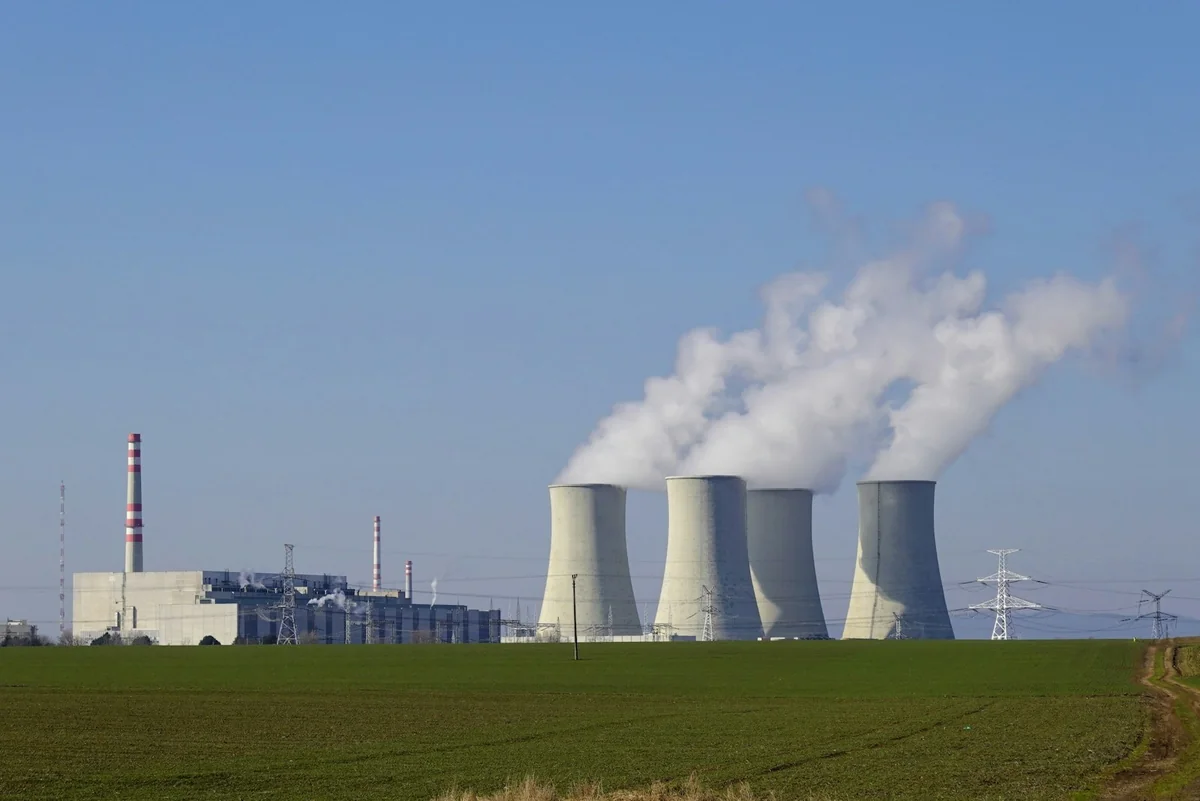 Cooling towers and electricity infrastructure at a nuclear power plant